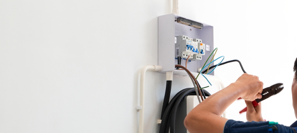 Licensed electrician performing home EV charging station installation in Salem for a residential property